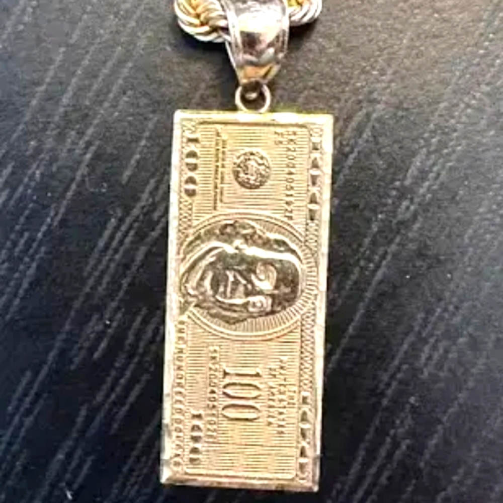 Cuban link chain with100 dollar pendent